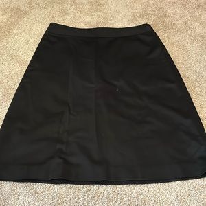 Banana Republic brand, women’s black colored skirt with zipper on the side.